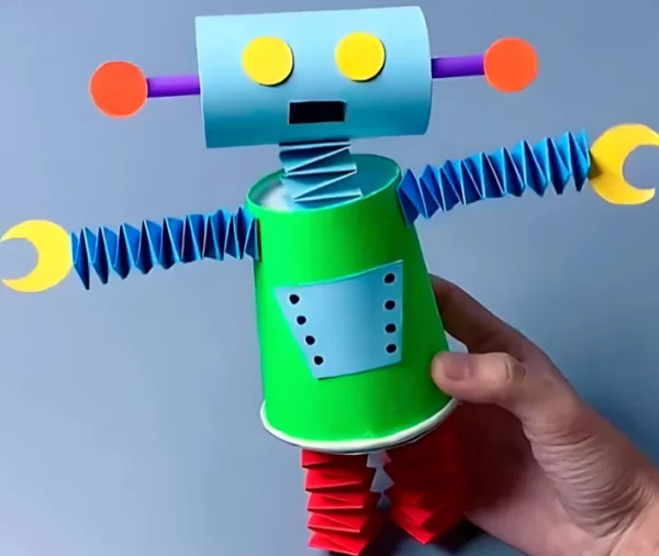 Robô de Sucata: Faça a melhor reciclagem criativa!Robô de sucata colorida, com copo descartável e rolo de papel.